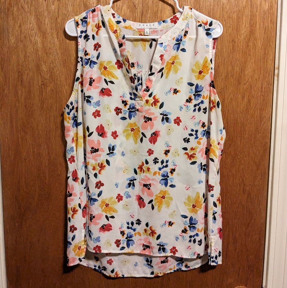 White floral sleeveless blouse with V neck